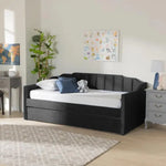 Black Krease Upholstered Daybed with Trundle Bed in a modern room setup, offering sleek style and dual functionality.