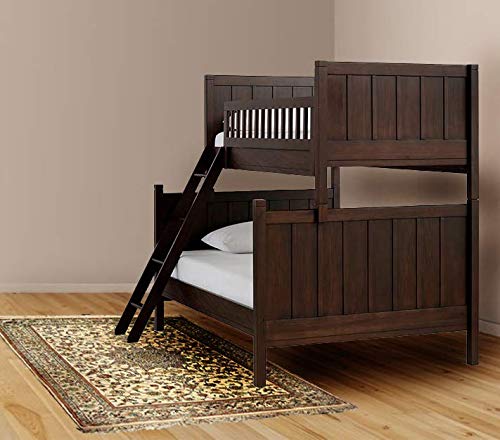 Brown wooden bunk bed with lower full bed and upper twin bed, featuring a ladder, placed on a patterned rug.