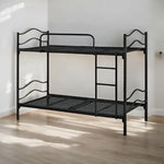 Black metal bunk bed in a room with wooden floor and white walls