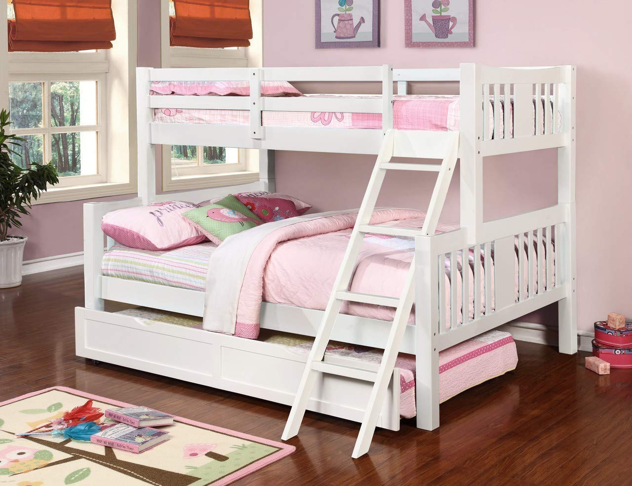 White bunk bed with pink bedding in a child's bedroom