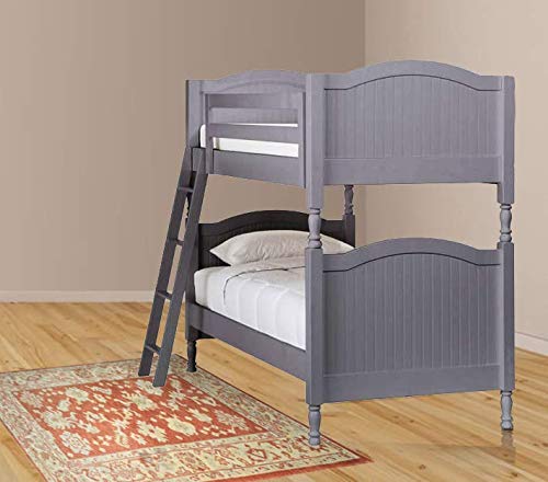 A gray wooden bunk bed with the lower bed made up, a ladder against the bed, placed on a red patterned rug.