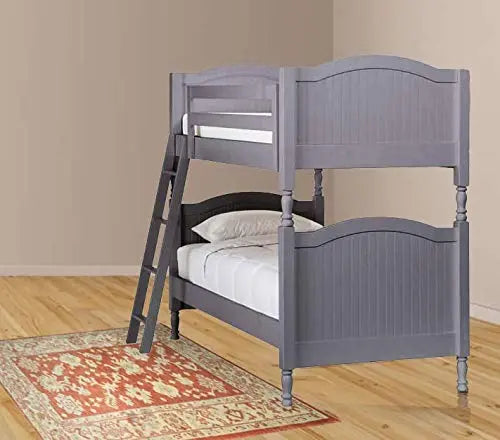 Translation missing: en.A gray wooden bunk bed with the lower bed made up, a ladder against the bed, placed on a red patterned rug